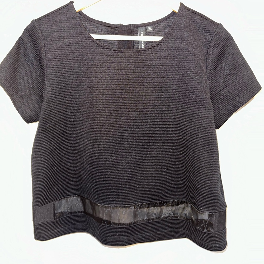 Boxy, black top with sheer lower hem
